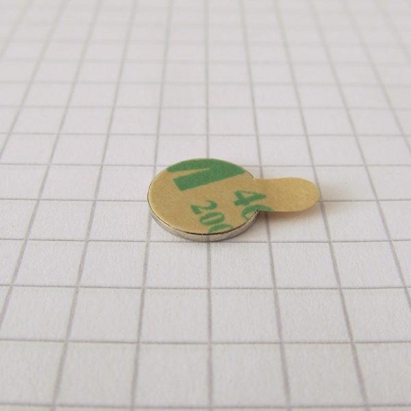 Neodymium magnet, disc, 10x1 mm, self-adhesive (south pole on side without backing) - N38