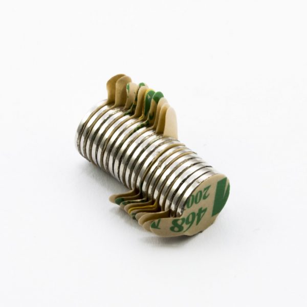 Neodymium magnet, disc, 10x1 mm, self-adhesive (south pole on side without backing) - N38