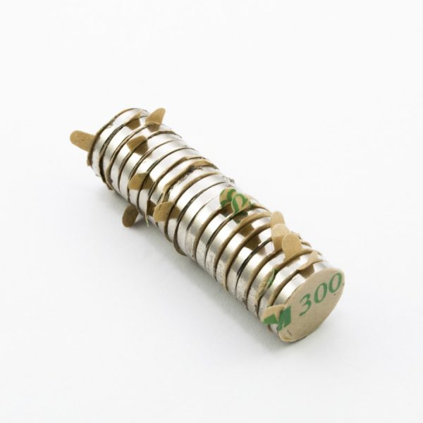 Neodymium magnet, disc, 12x2 mm, self-adhesive (south pole on side without backing) - N30