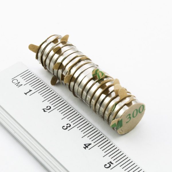 Neodymium magnet, disc, 12x2 mm, self-adhesive (south pole on side without backing) - N30