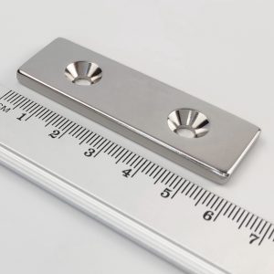 Neodymium magnet, block, 60×20×4 mm, with 2 holes M4 (north pole on the countersunk side) - N38