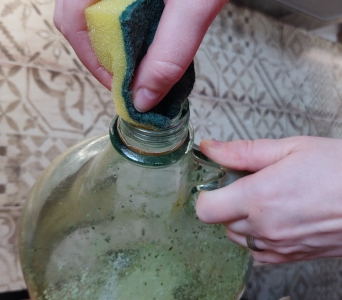 tip inserting the dish sponge into the jug