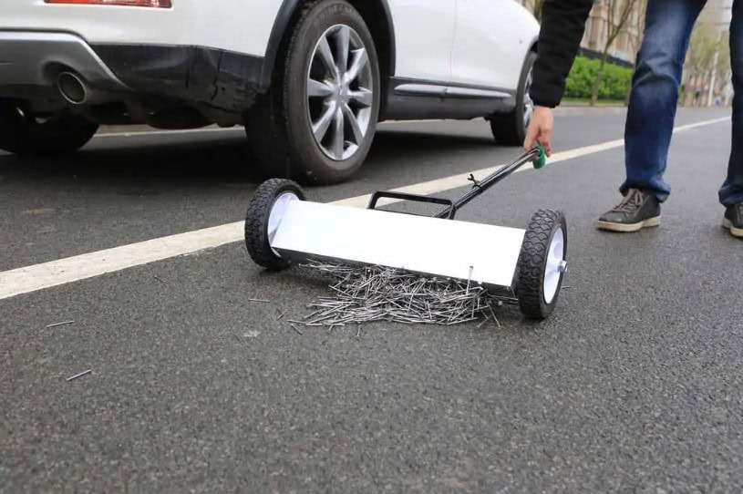 sweeper A-60 collects nails on the road
