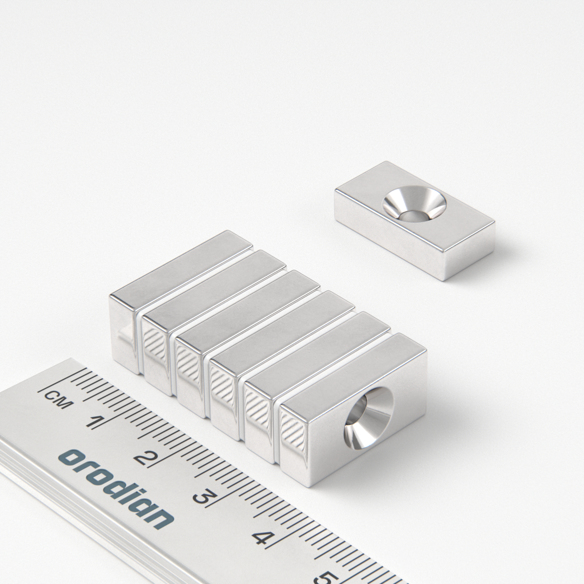 Neodymium magnet, block, 20×10×5 mm, with hole M4 (north pole on the countersunk side) - N38