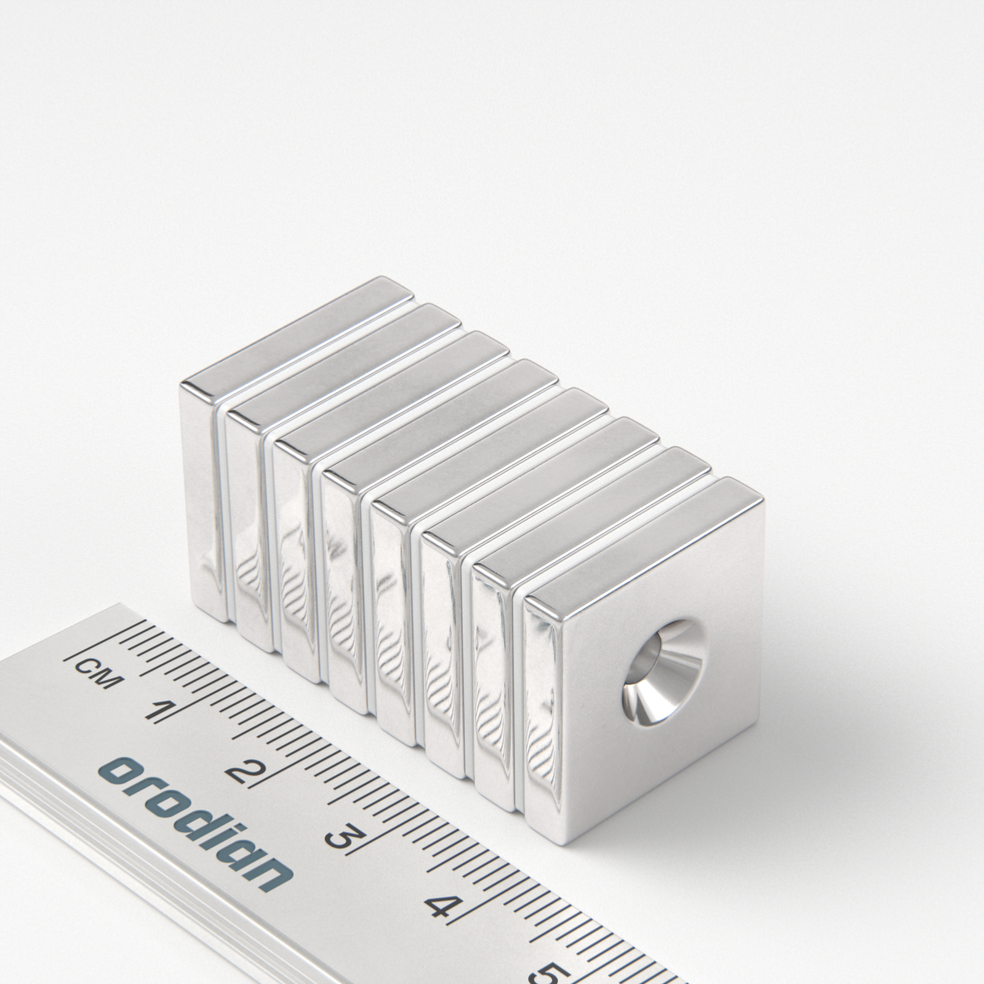 Neodymium magnet, block, 20×20×4 mm, with hole M4 (north pole on the countersunk side) - N38