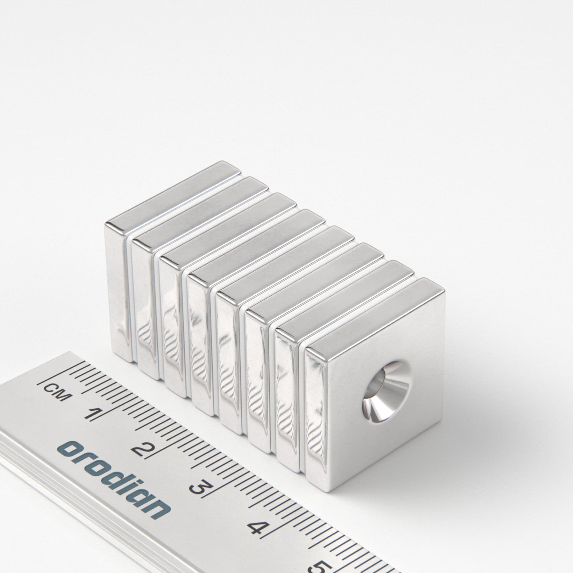 Neodymium magnet, block, 20×20×4 mm, with hole M4 (south pole on the countersunk side) - N38