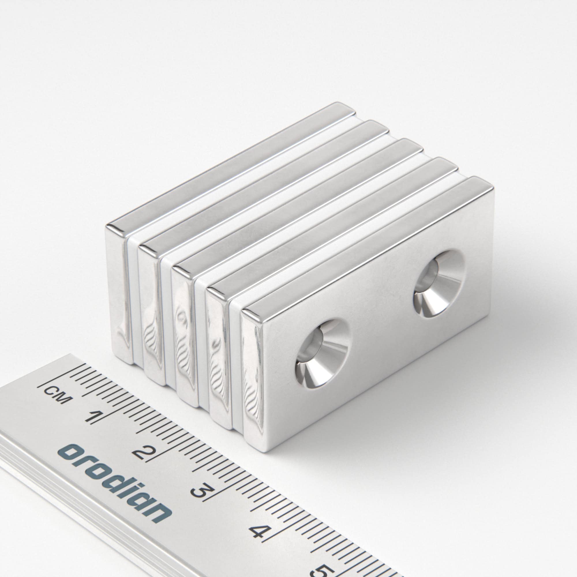 Neodymium magnet, block, 40×20×4 mm, with 2 holes M4 (south pole on the countersunk side) - N38
