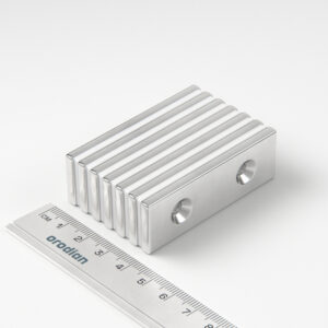 Neodymium magnet, block, 60×20×4 mm, with 2 holes M4 (north pole on the countersunk side) - N38