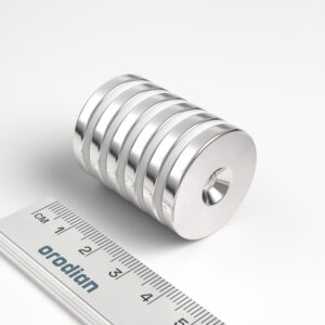 Neodymium magnet, disc, 27×4 mm, with hole M4 (south pole on the countersunk side) - N38