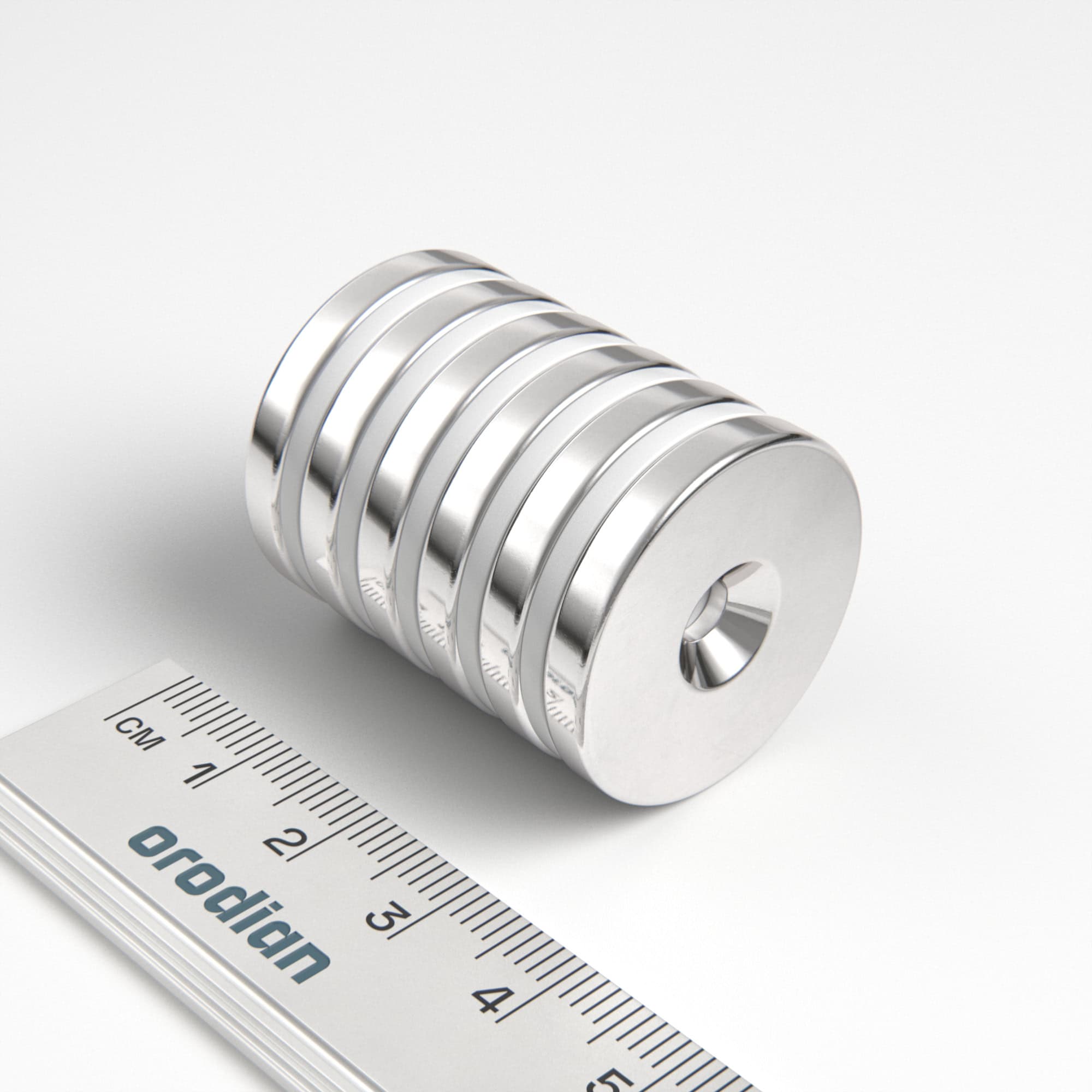 Neodymium magnet, disc, 27×4 mm, with hole M4 (south pole on the countersunk side) - N38