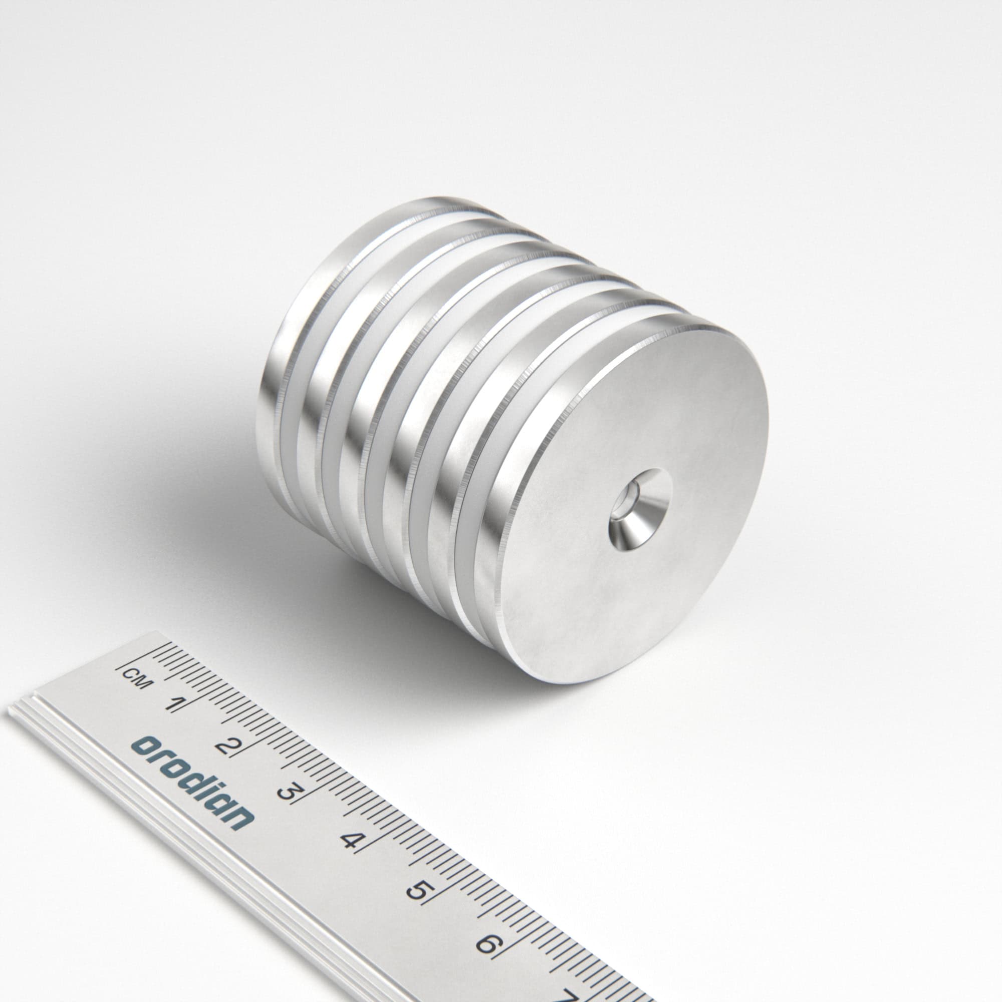 Neodymium magnet, disc, 42×4 mm, with hole M4 (south pole on the countersunk side) - N38